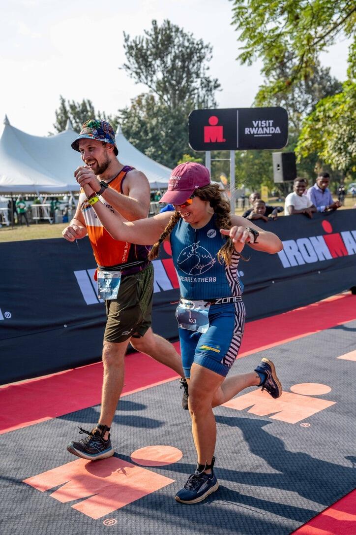 Finishing the Ironman 70.3 together.
The only time Chris has ever been able to talk without Aly interrupting—because she was too out of breath. He chose to use this moment to talk about mining in the DRC.