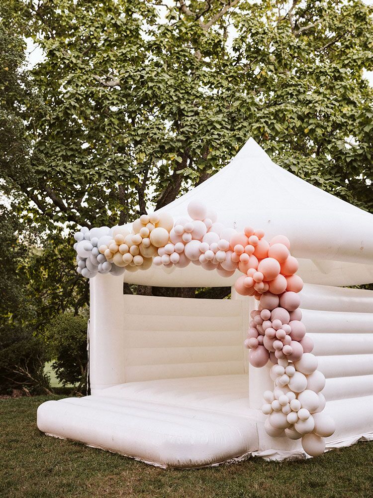 bouncy castle decorated with balloons