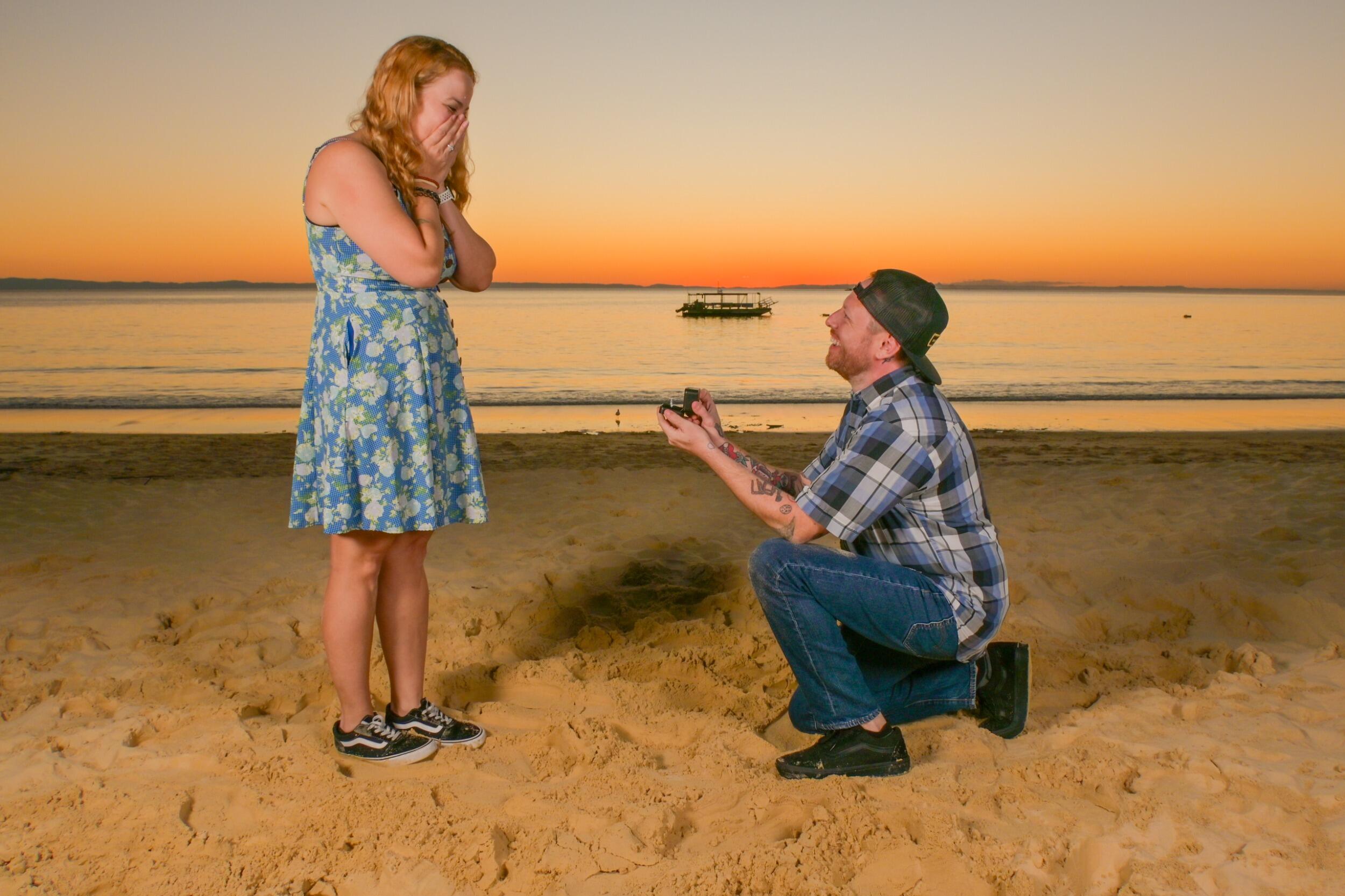 Sam proposes in Australia at the end of a joke photo shoot. After tons of giggling and improvising awkward poses, Sam says "one more pose" and gets down on one knee. So smooth.