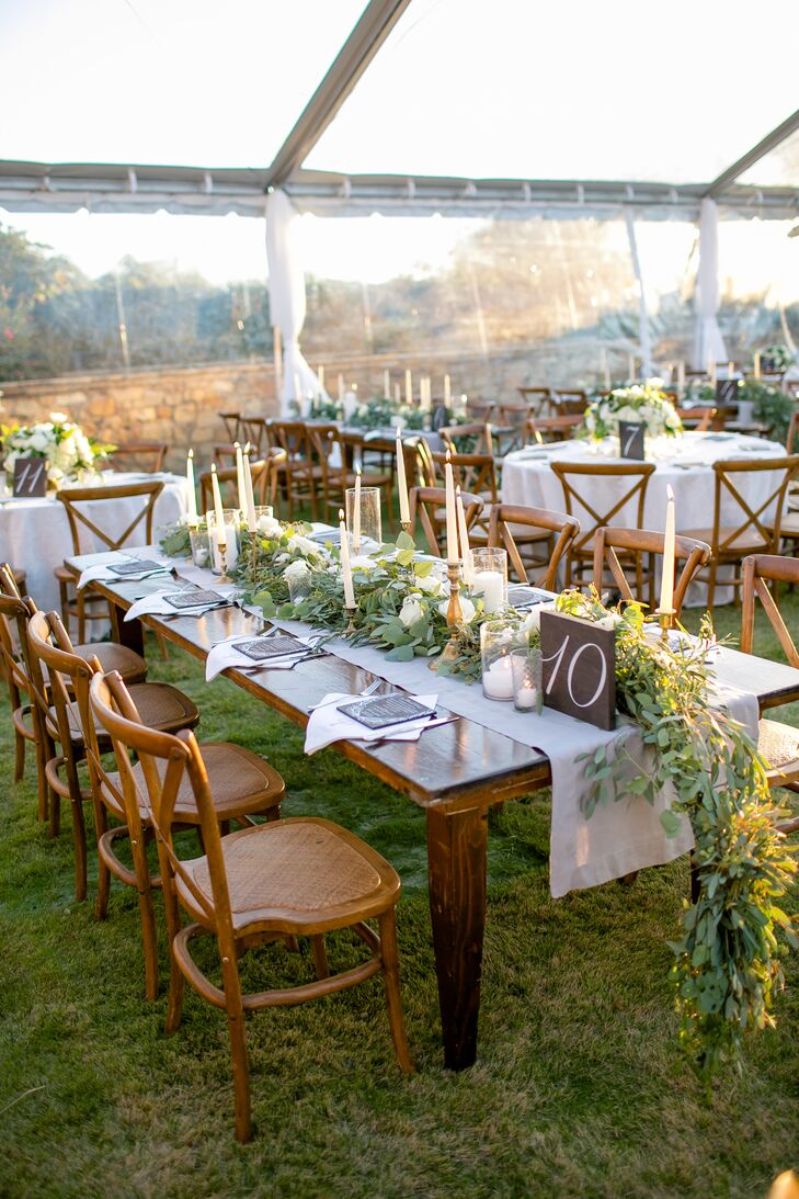 Chic Farm Tables with Taper Candles and Garland