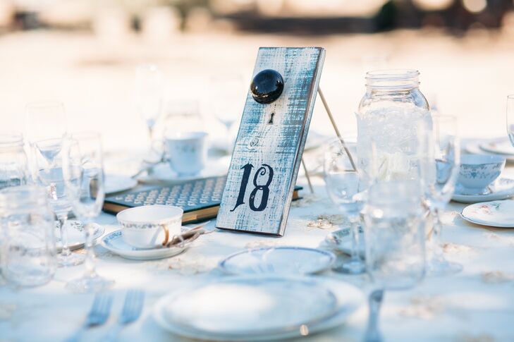 Monique and Shade created many of the details that decorated the space at Rancho San Antonio in Santa Ynez Valley, California, including the white slab of wood with a number written in black displayed at each table.