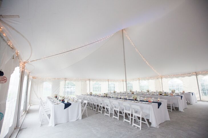 Farm-style tables with white linens and white folding chairs created a clean look under the tent.