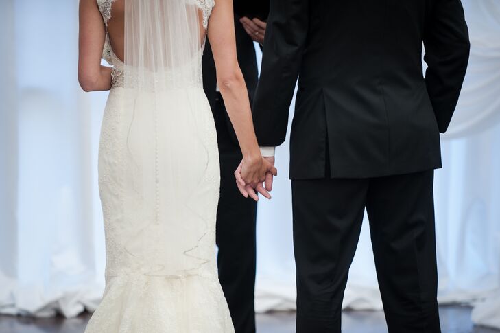 Bride and Groom Holding Hands During Ceremony