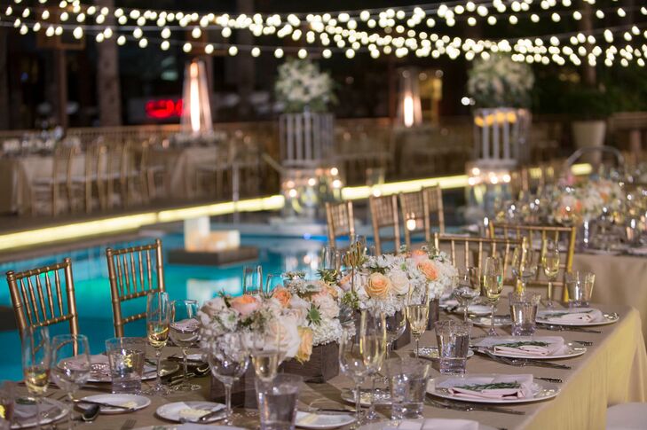 After the ceremony, the guests went inside for the cocktail hour and the outdoor area was transformed into the dinner reception area. All the tables were situated around the pool. The centerpieces consisted of peach and ivory roses accented with desert succulents in a wooden planter boxes.