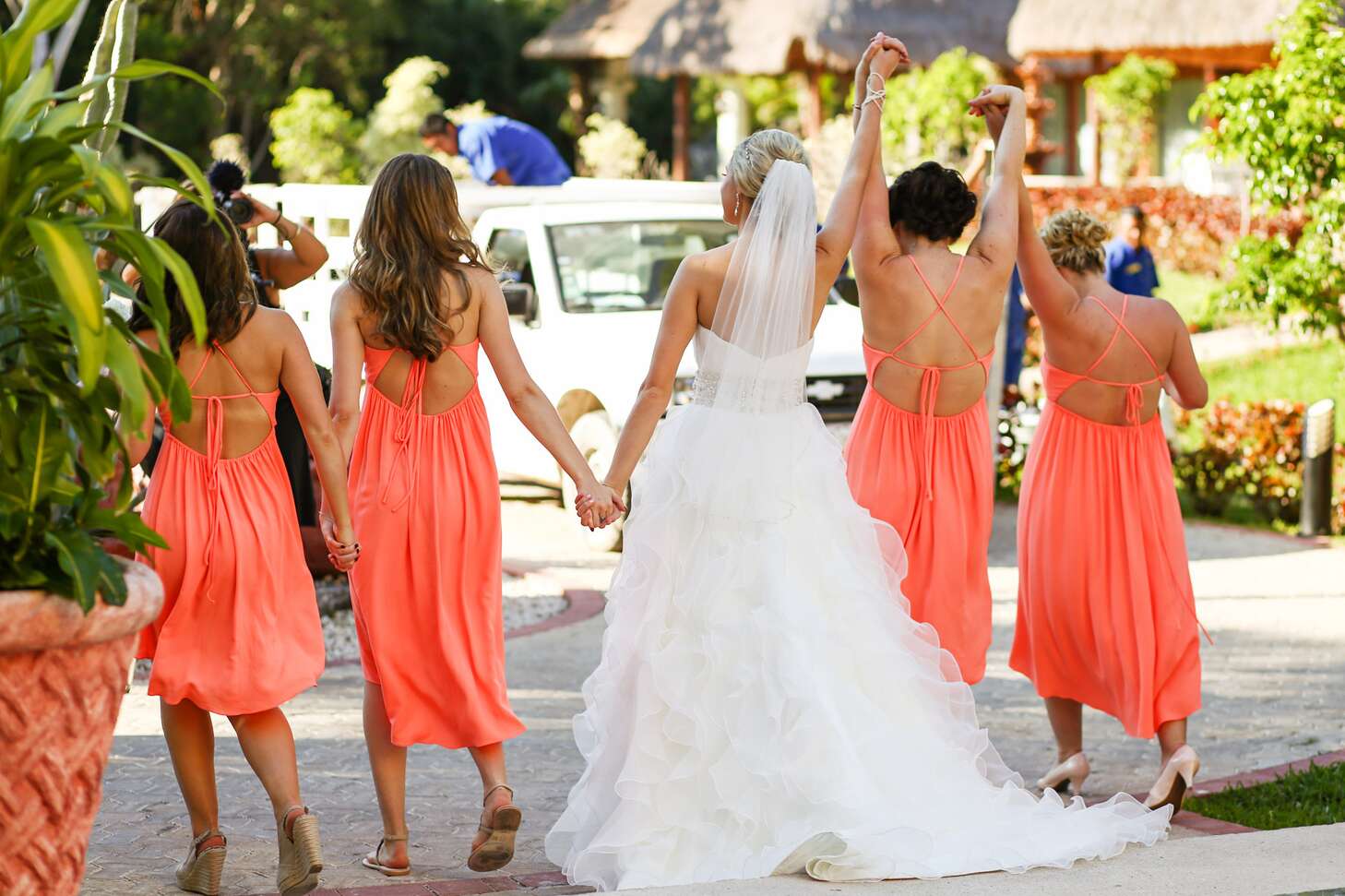 Coral Crisscross-Strapped Bridesmaid Dresses