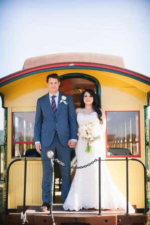 Couple Standing on Yellow Trolley