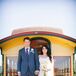 Couple Standing on Yellow Trolley