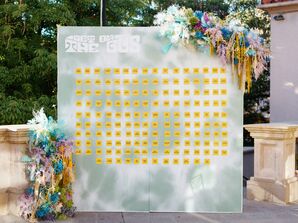 Retro, Grateful Dead-Inspired Escort Card Display With Tie-Dyed Flowers