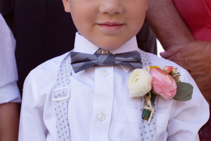 The ring bearer wore a simple, ivory and pink boutonniere made from ranunculus flowers.