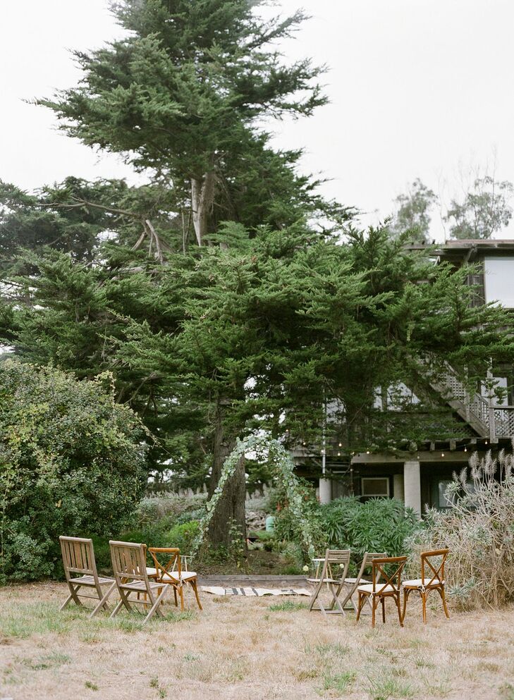 Simple Backyard Wedding Ceremony With Wood Chairs