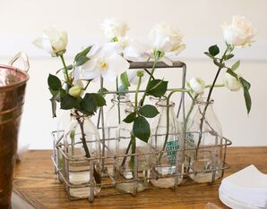 White Orchids in Glass Milk Bottles
