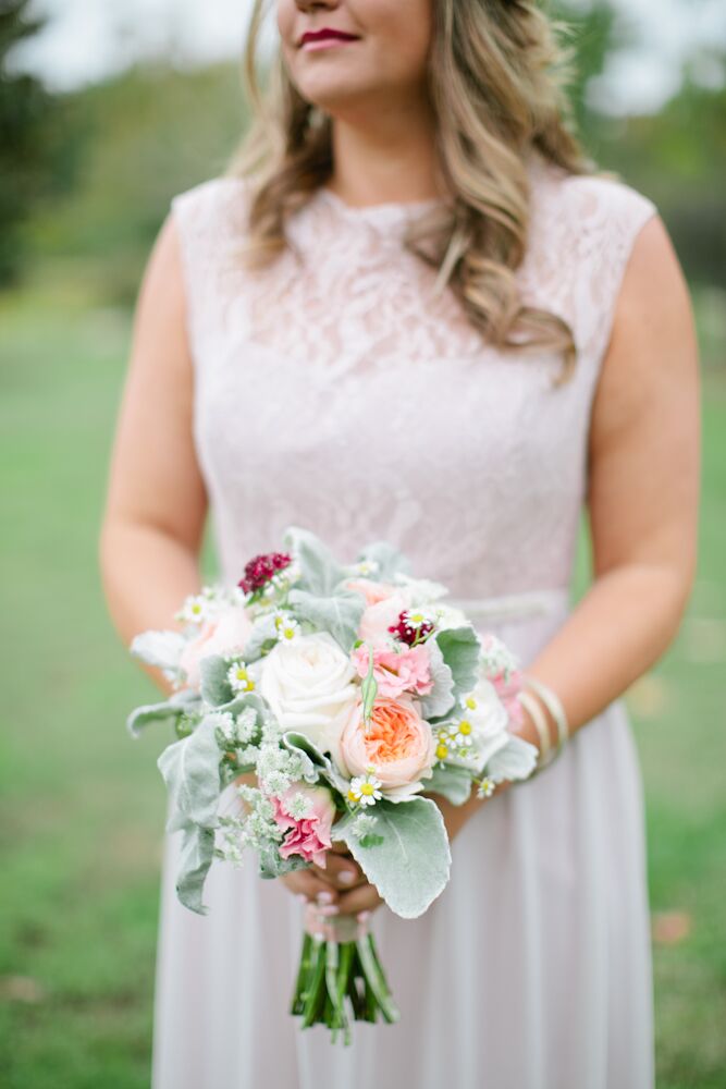 The bridesmaids carried lamb’s ear, white roses, peach garden roses, Queen Anne’s lace and wildflowers in their textured bouquets. Jessica loved how the lush florals reminded her of her mother’s garden, which she loved to sit in when she was young.