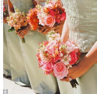 The bride carried a bouquet of white blooms with accents of pale green; the bridesmaids’ bouquets were peach and pink.