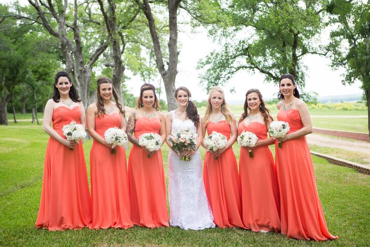 The bridesmaids wore strapless, floor-length peach chiffon dresses with light tan wedges and mint necklaces. “The flowy bridesmaid dresses resembled my free-spirit dance background,” the bride says.