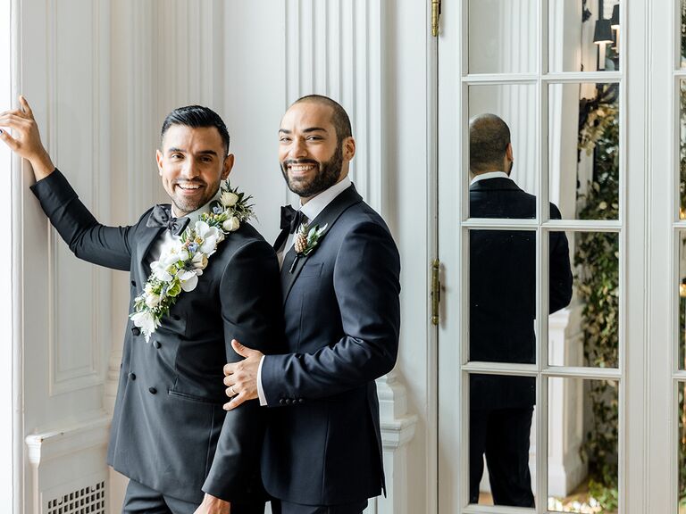 two grooms standing together and smiling