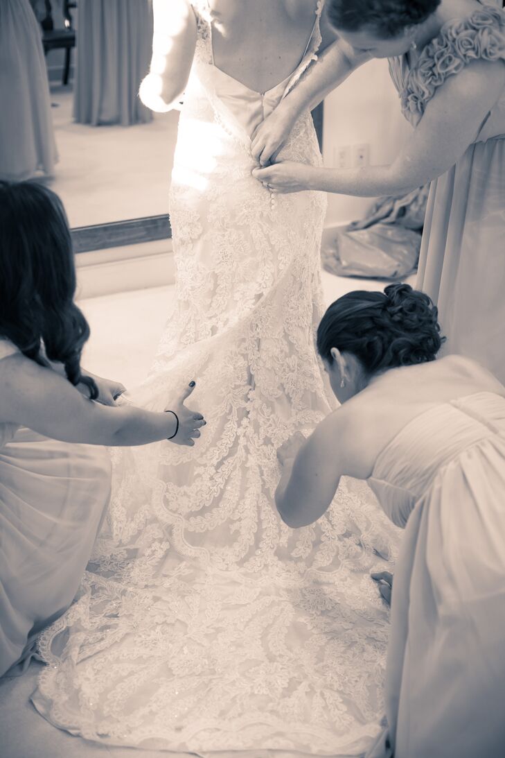 Bridesmaids Fixing Lace Wedding Dress Train