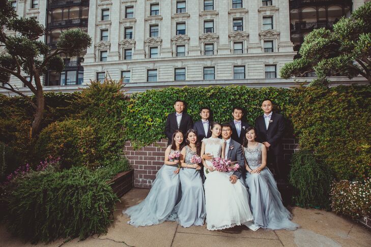 Dongli and Chengyuan posed with their wedding party dressed in blue accents. The bridesmaids wore long blue dresses with embellished bodices, while the groomsmen wore light purple bow ties with their black suits.