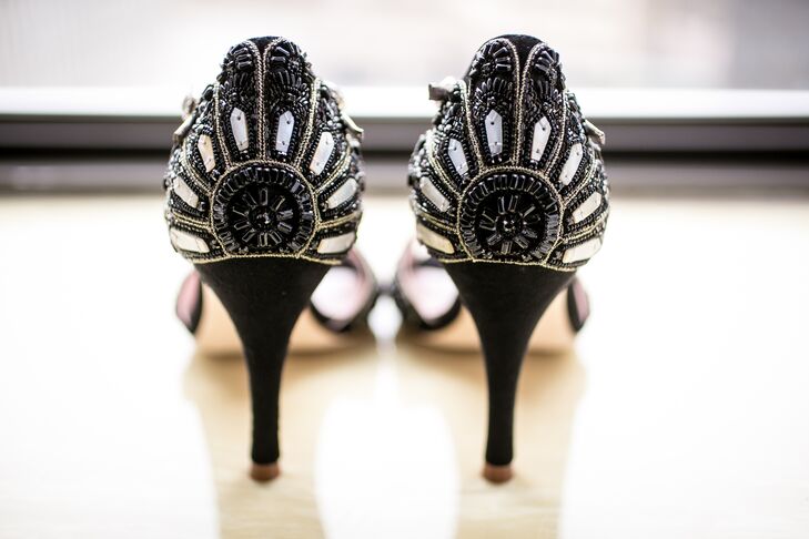 The bride's favorite accessory was a pair of handmade, specially designed shoes from Emmy London. They were black with mother of pearl and crystal embellishments, given to her as a wedding gift from the groom.
