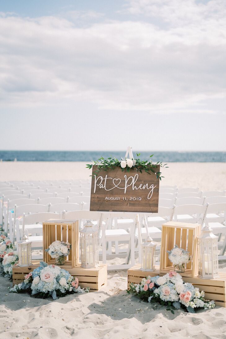 Wooden Welcome Display at Beach Wedding Ceremony