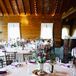 Barn Reception with String Lights and Purple Decor