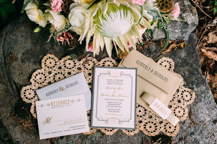Talk about regal! The couple gave their 185 guests Beacon Lane invitations that looked as if they were welcomed to a ball. Thin black and gold alternating script filled the cards from within whimsical borders. A gold ribbon wrap brought together every piece for a fun yet sophisticated design.