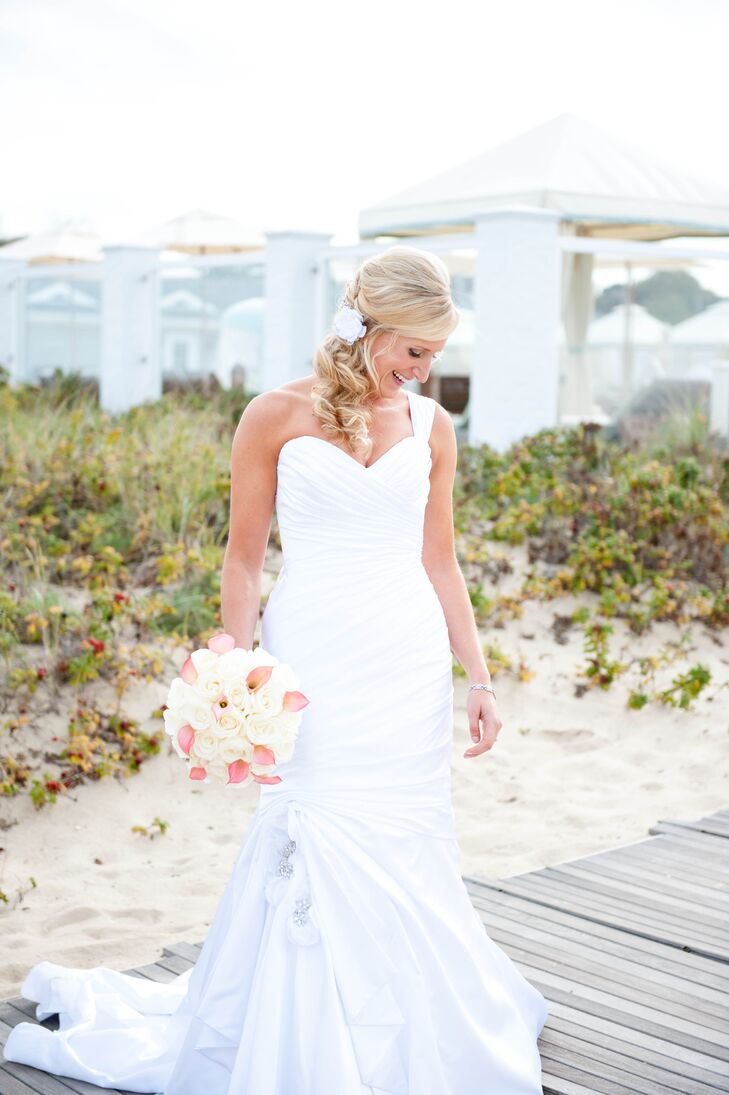 Kendall wore a silk, one-shoulder wedding dress with a sweetheart neckline and a mermaid silhouette by Maggie Sottero. Its pure white color matched Greg's military whites.