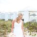 Kendall wore a silk, one-shoulder wedding dress with a sweetheart neckline and a mermaid silhouette by Maggie Sottero. Its pure white color matched Greg's military whites.