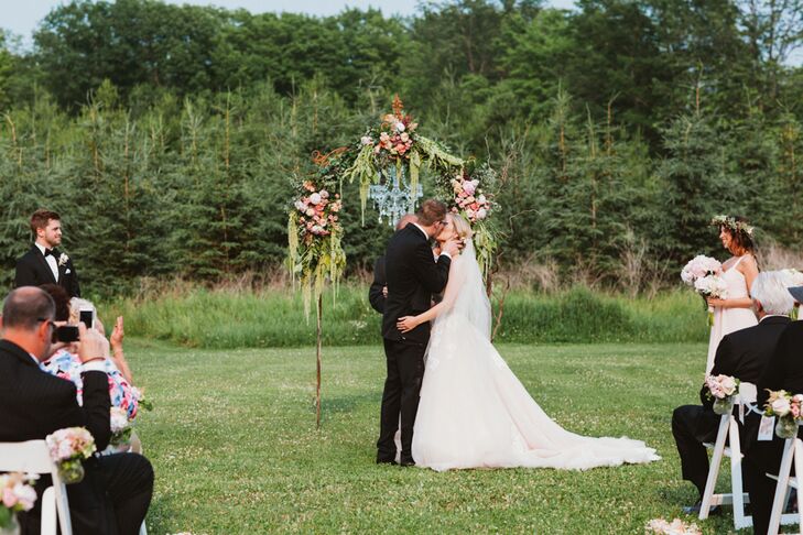Katherine and Kevin decided to ditch tradition and create a ceremony that reflected their personalities and relationship. In addition to writing their own heartfelt vows, the couple had their sisters read poems of their choosing in place of tradition readings. “Our officiant Allin Walker, the owner of Woodwalk, also did something cool with our rings,” says Katherine. “Before we exchanged rings, he had each person in the wedding party put their hands on them and make a wish for our future.”