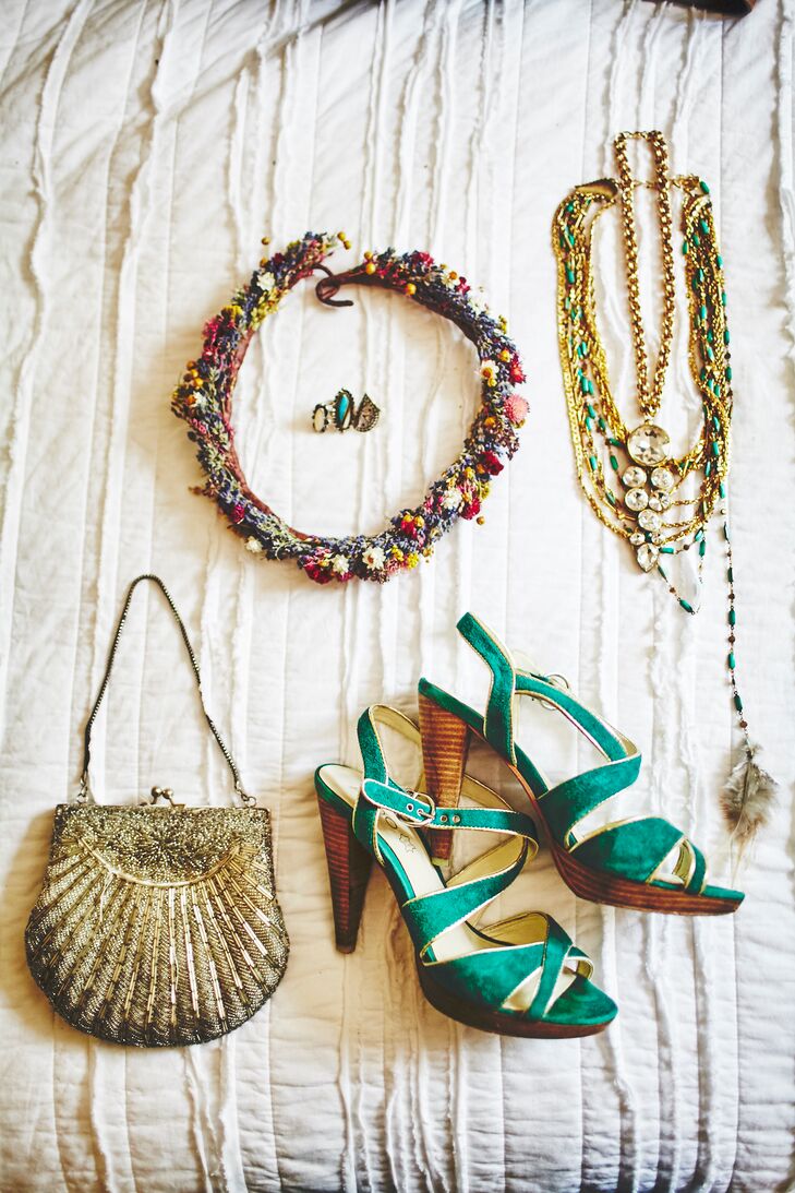 Velvet turquoise shoes with gold trim and wooden heels added a vibrant pop of color to the bride's look. Angela, a jewelry designer, made herself a statement necklace by repurposing and combing several vintage necklaces. “My favorite part of the necklace was having a single turquoise and gold stead down my back with a feather at the end,” Angela says.