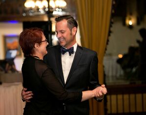 Groom in Formal Ted Baker Tuxedo Dances with Mother at Alex Johnson Reception