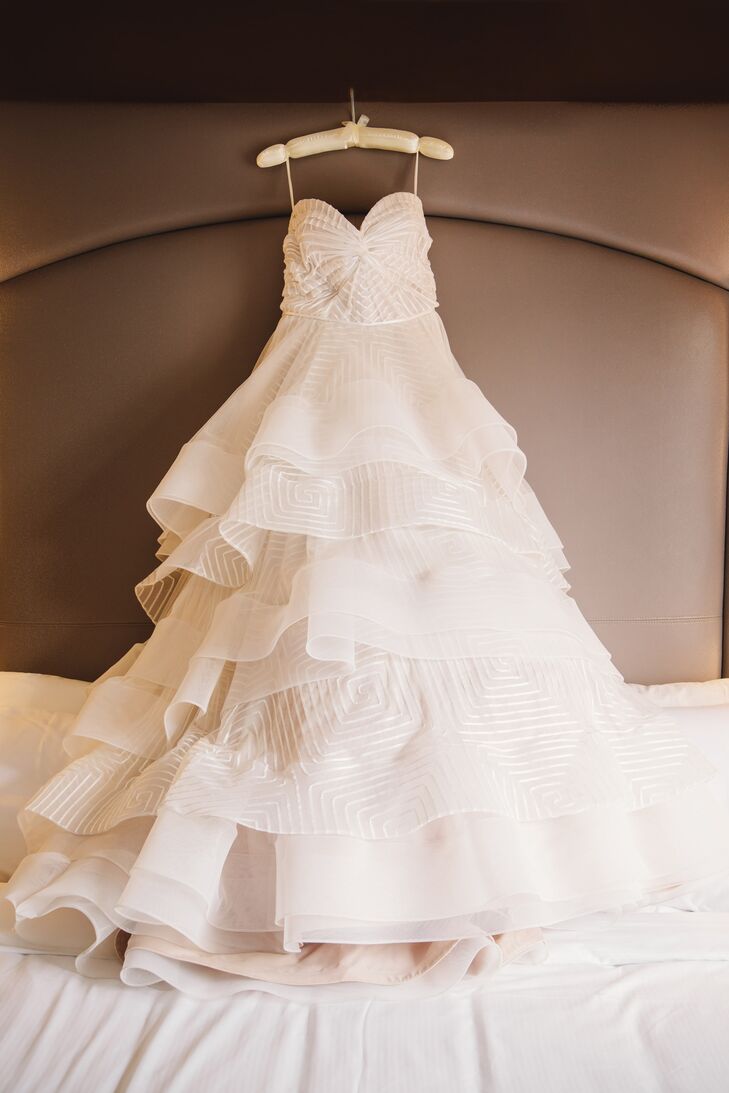 Crystal selected a Hayley Paige gown with a twist sweetheart bodice and an ivory geometric ball gown with a chapel train.