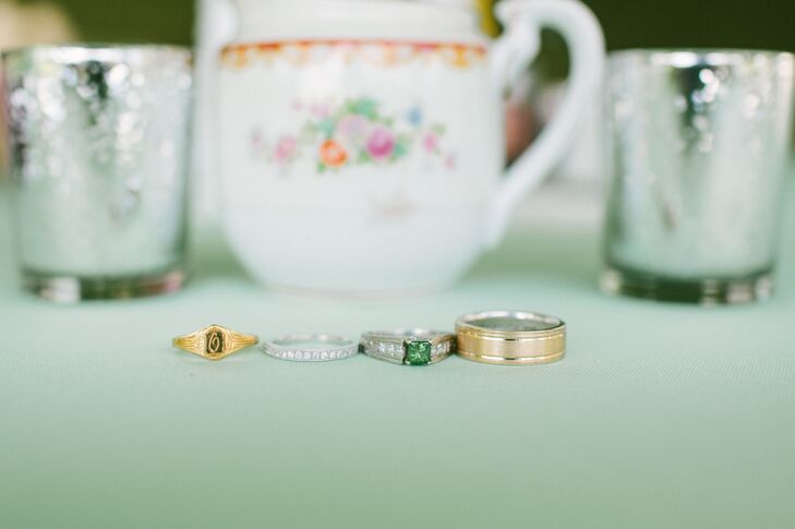 The couple opted for classic styles with a contemporary twist for their wedding bands. Lauren chose a simple diamond, white gold band to match her emerald engagement ring, while Carter selected a brushed, yellow gold band with polished etching.