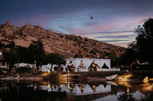 White Structure Tent With White Drapery in Estate's Lake Reflection at Dusk