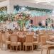 Glam Wedding Reception With Hanging Flowers and Upholstered Chairs
