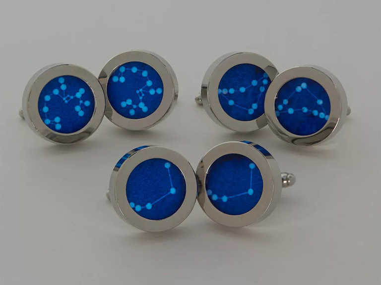 Round silver cuff links with blue constellation design