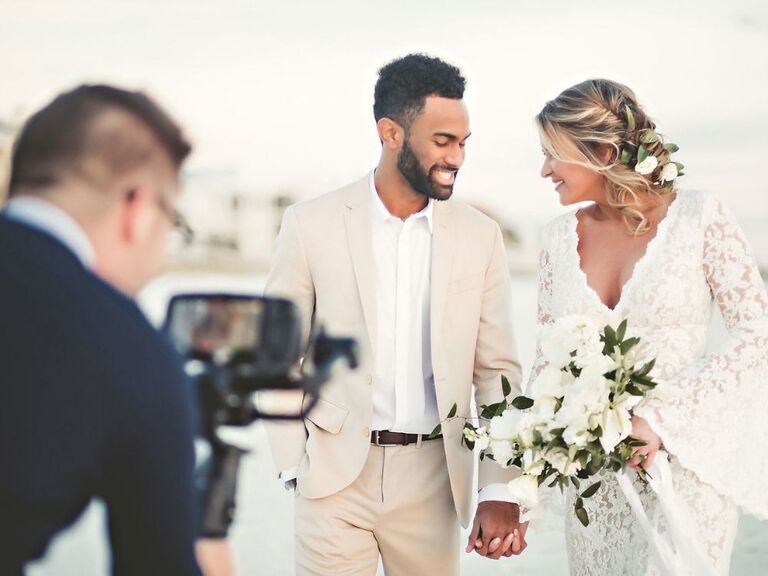Videographer capturing couple on wedding day