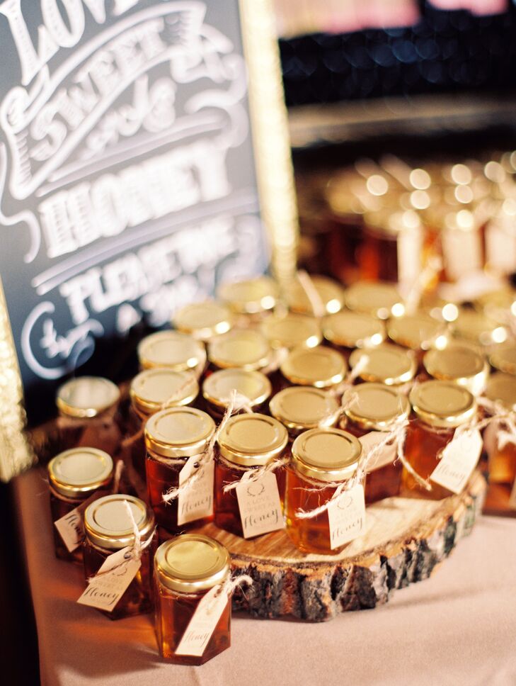 As a thank you to their guests for their love and support, Kristina and Joe sent their guests home with jars of locally made honey. Each jar was dressed up with a handmade tag featuring the wedding's antler motif.