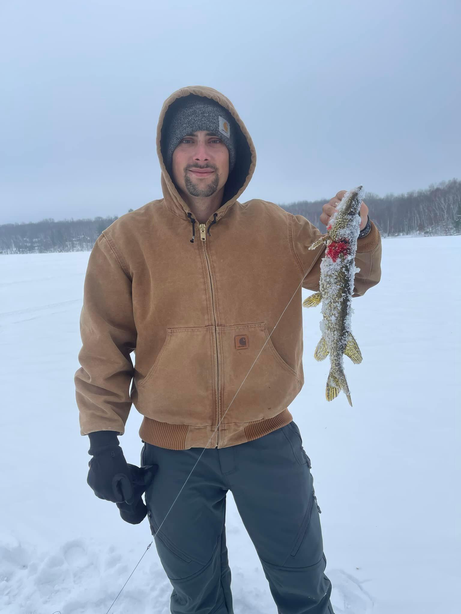Issam's first time ice fishing during the Minnesota winter.