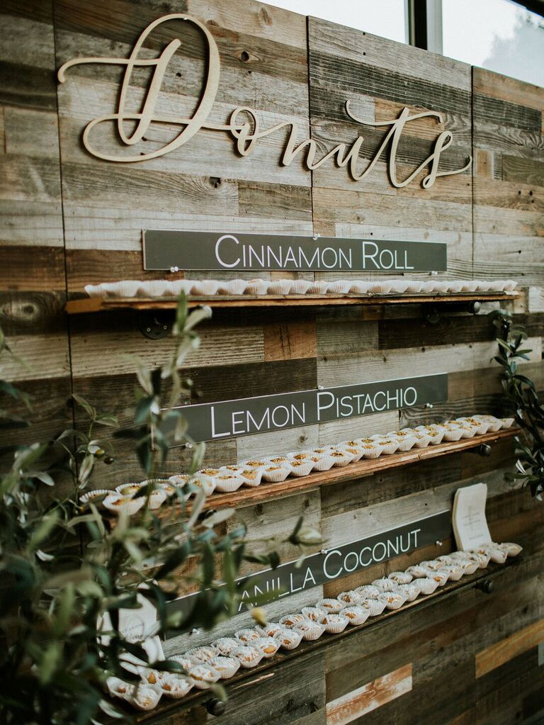 Rustic doughnut wall at wedding reception