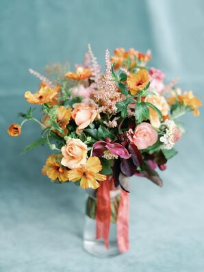An Artistic Bouquet Filled With Blush and Orange-Yellow Flowers
