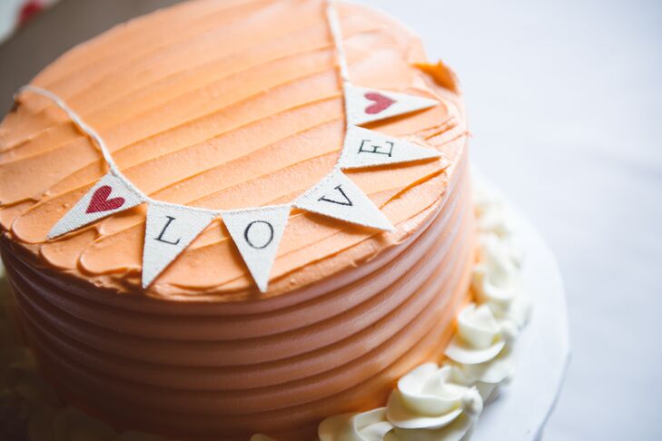 "We avoided most of the traditional wedding events however, we did cut a beautiful little tangerine colored cake," says Bernice.