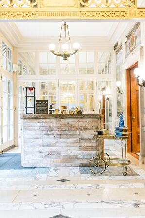 Bar With Custom Wood Bar Front and Vintage Gold Bar Cart at the Anderson House in Washington, DC