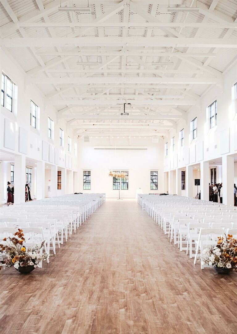 Ceremony in airy white warehouse venue
