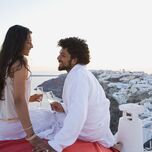 Couple toasting champagne on honeymoon