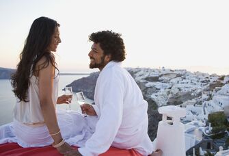 Couple toasting champagne on honeymoon