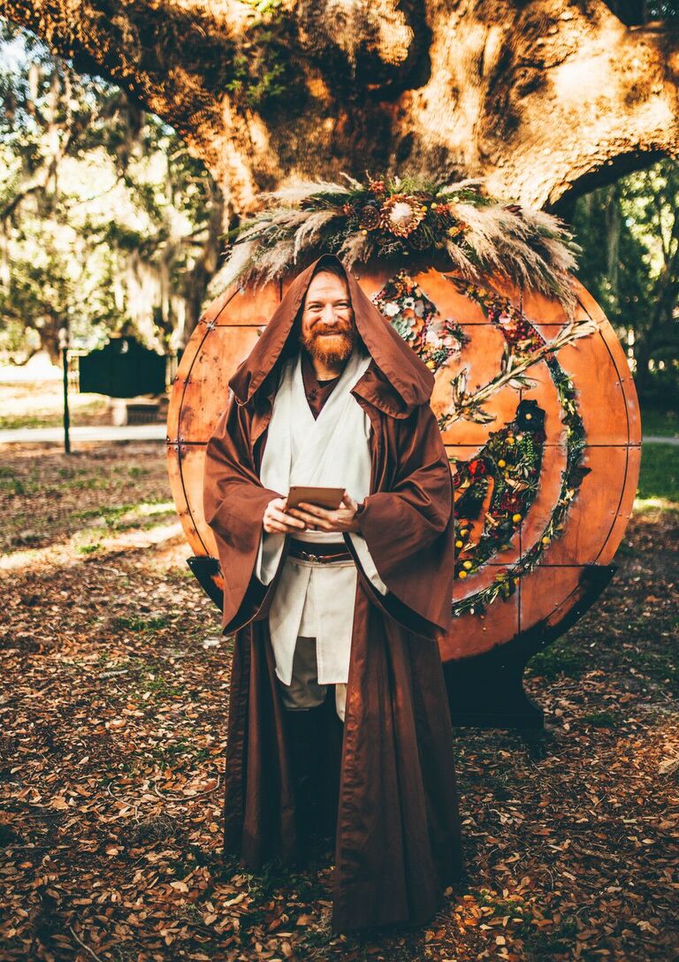 Officiant in brown robe