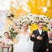 Although Chris is Catholic, it was important for Emily to have a somewhat traditional Jewish ceremony, including being married by a rabbi under a huppah (symbolized by the floral arch).