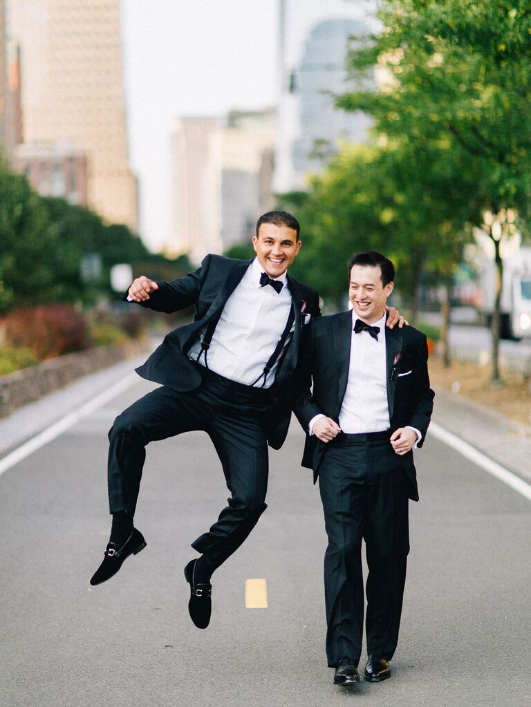 Groom posing for photo with his best man