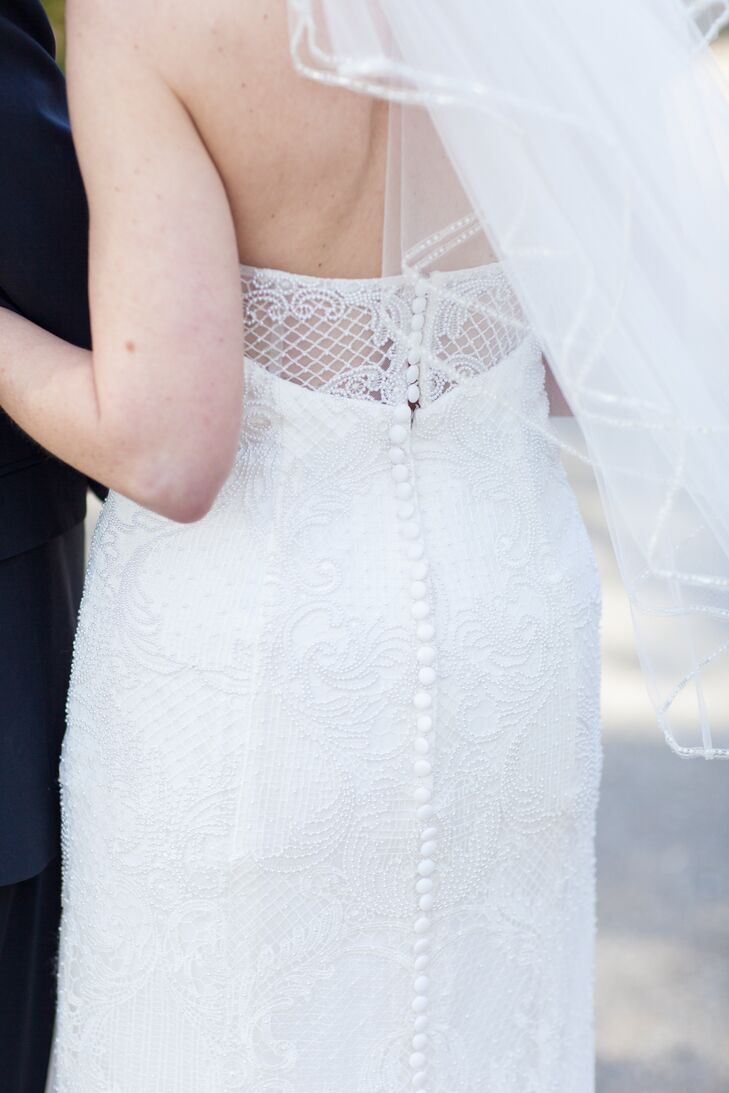 The back of Lisa's Oleg Cassini dress had a tulle inlay and featured buttons all the way down the back. "I knew it was the perfect gown for me when I put on a veil and my mother, sister, niece and I all broke into tears," she says.