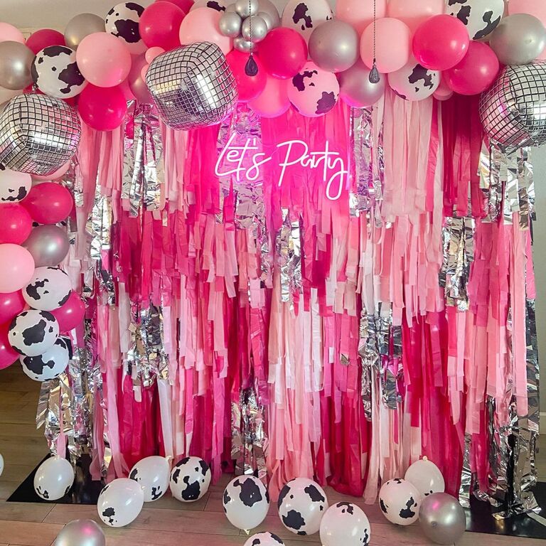 Pink and silver fringe backdrop for a bachelorette party. 